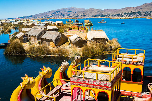 Uros islands View of Uros floating islands with typical boats, Puno, Peru inca photos stock pictures, royalty-free photos & images