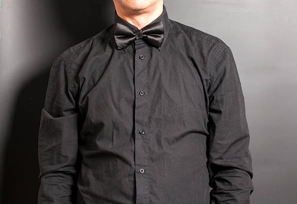 istock Man Dressed Black Shirt With Black Bow 547137506
