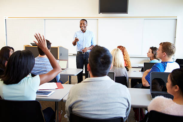 istock Male Tutor Teaching University Students In Classroom 547139338