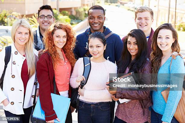 Portrait Of University Students Outdoors On Campus Stock Photo - Download Image Now - Campus, Education, File Folder