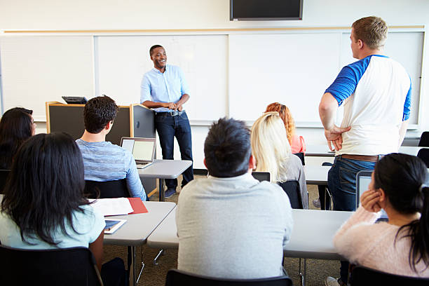 istock Male Tutor Teaching University Students In Classroom 547139400