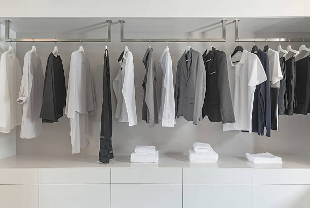 istock black and white color tone clothes hanging on rail 547139672
