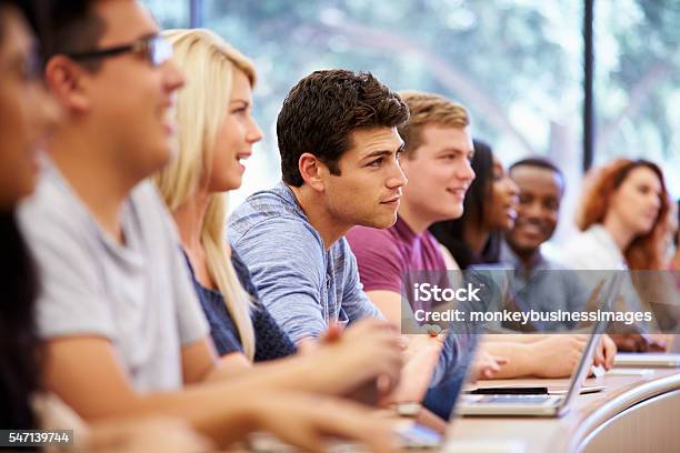 Class Of University Students Using Laptops In Lecture Stock Photo - Download Image Now