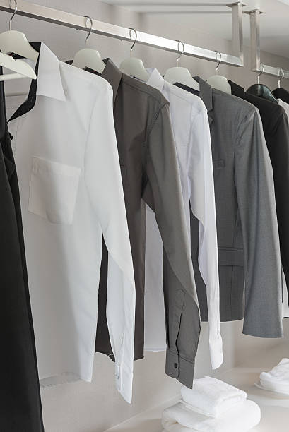istock black and white color tone clothes hanging on rail 547139784