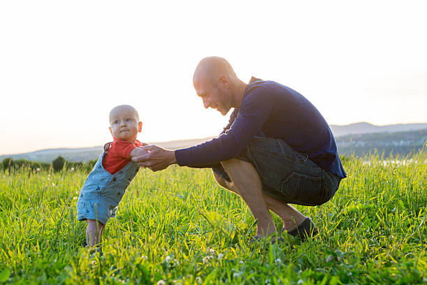 istock father and baby at sunset 547139854