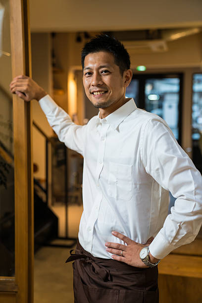 istock Small business cafe owner greeting customers 547139940