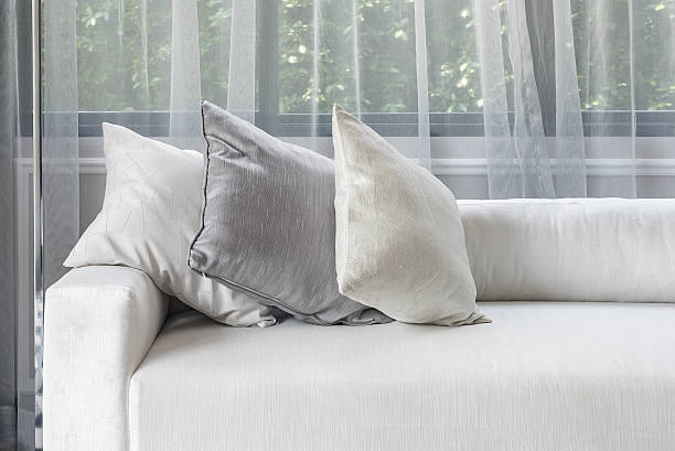 istock luxury white sofa with pillows set in living room 547141020