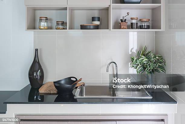 Modern Sink On Black Kitchen Counter Stock Photo - Download Image Now - Burner - Stove Top, Cabinet, Chrome