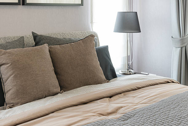 istock brown pillows on bed with black lamp in modern bedroom 547141790