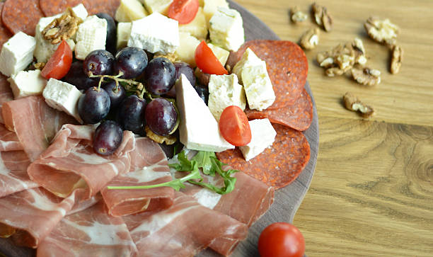 istock Greek salad with ham and grapes closeup 547141808