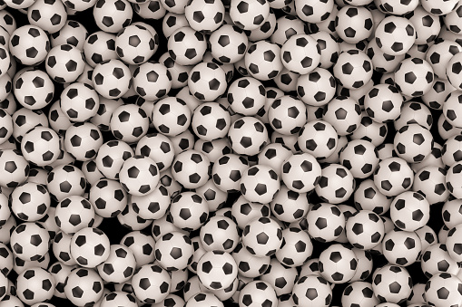 Pile of football balls as a background