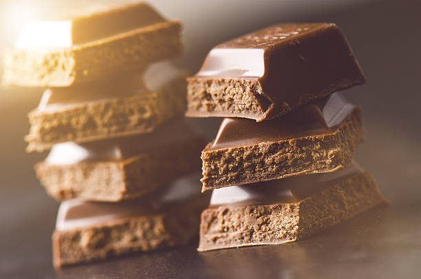 istock Two chocolate buildings on a dark background. energy and sugar. 547143760