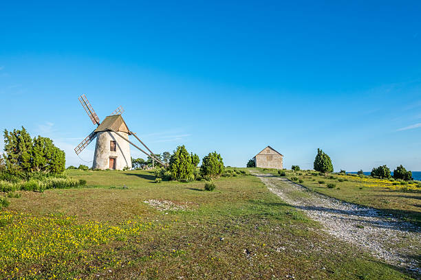 Old windmill on Gotland in Sweden Old windmill on Baltic sea island Gotland during summer in Sweden gotland stock pictures, royalty-free photos & images