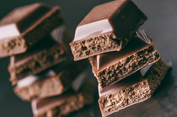 istock Two chocolate buildings on a dark background. energy and sugar. 547143944