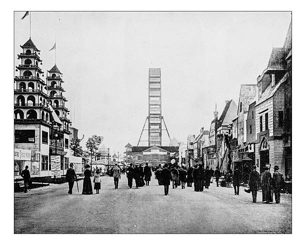 Antique photograph of the World's Columbian Exposition (Chicago,USA,1893) Antique photograph of the so-called "Midway", the central street of the World's Columbian Exposition held in Chicago (USA) in 1893: the road is crowded with people visiting the fair, on the left the entrance to the Chinese village and on the right the "Old Vienna" and in the centre the Ferris Wheel ferris wheel photos stock illustrations