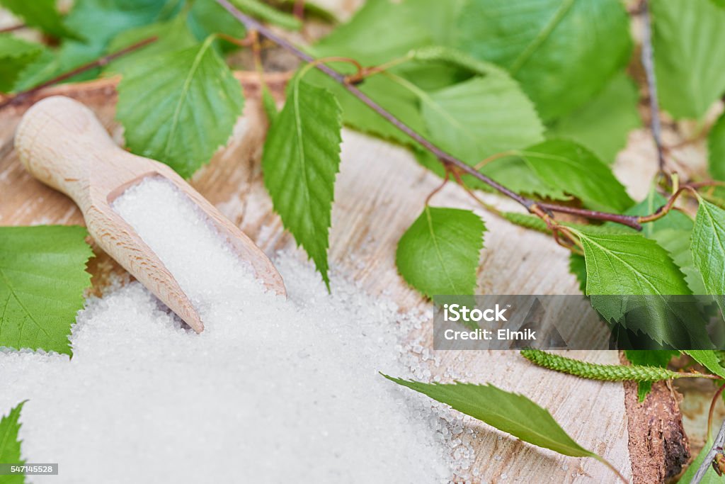 Xylitol birch sugar on a birch background Xylitol Stock Photo