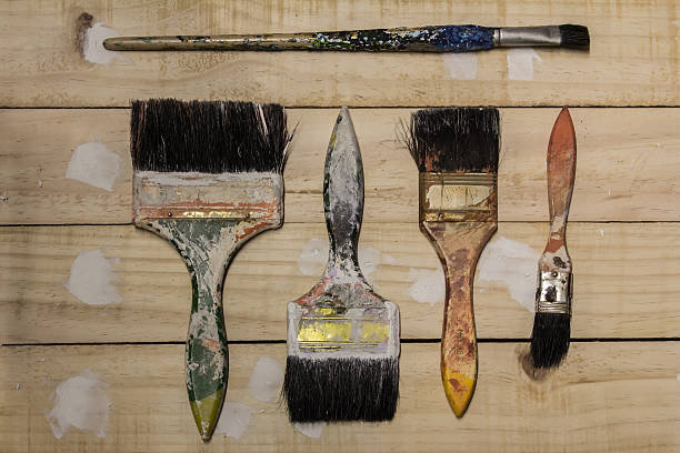 istock Paint brushes and tools on a wooden background. 547147120