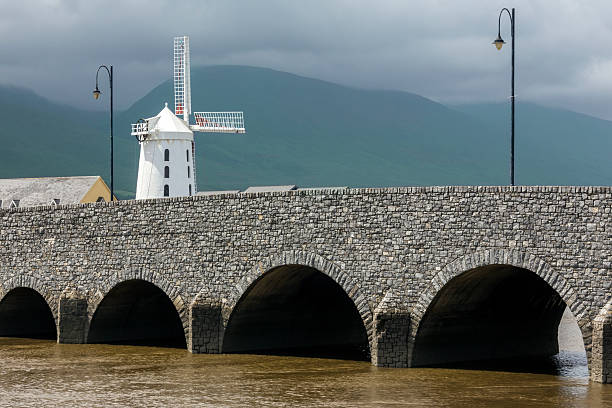 Blennerville, Ireland - June 15, 2016: The Blennerville Windmill in County Kerry in the Republic of Ireland. Blennerville Windmill is a tower mill  and the tallest of its kind in Europe at 21.3 metres high. It was built by Sir Rowland Blennerhassett in 1800 whom the village of Blennerville is named after. The windmill was used for grinding corn for both the local population and for export to Britain.
