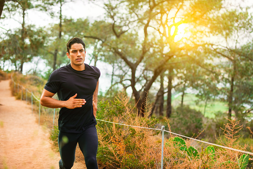 Hispanic Runner In The Forest