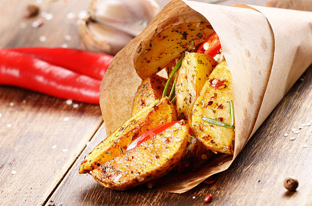 istock Boiled and baked potato in paper 547150448
