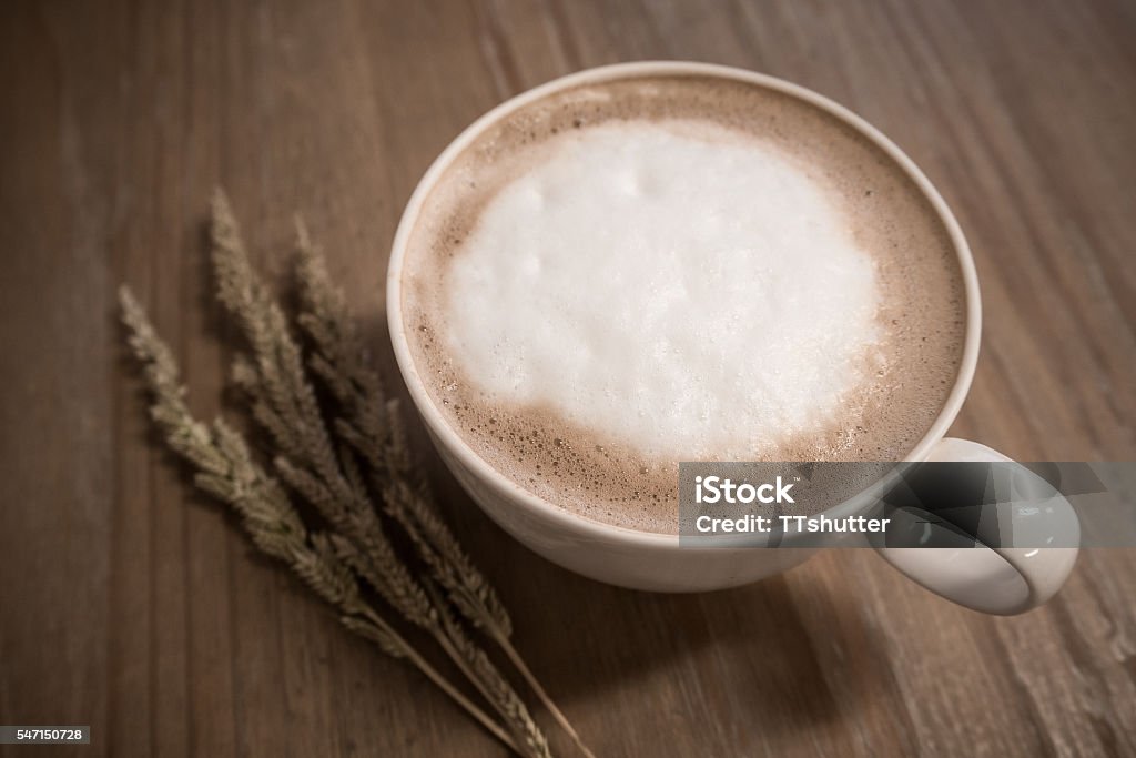 Hot mocha. Hot coffee in the ceramic cup on the table. Activity Stock Photo