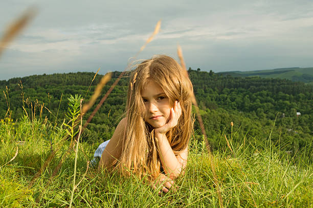 sunny の少女  - blond hair overcast sun sky ストックフォトと画像