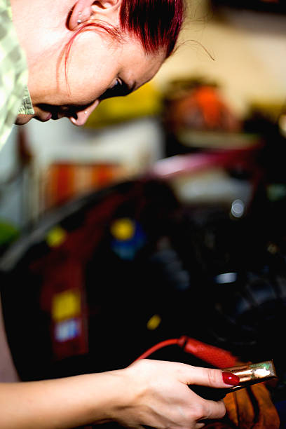 istock Young women working in workshop on car 547152346