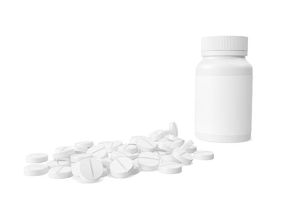 istock Pills out of pill bottle isolated on white background. 3d 547154724