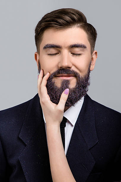 istock Smiling man posing with closed eyes in studio 547154760