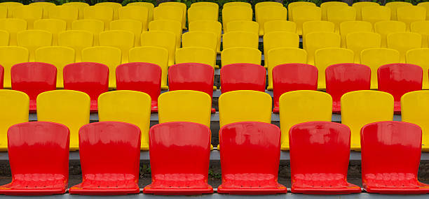 istock yellow-red grandstand at the stadium 547155102