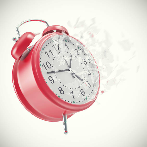 istock Soaring Clock alarm  with broken glass shattered into small pieces 547157454
