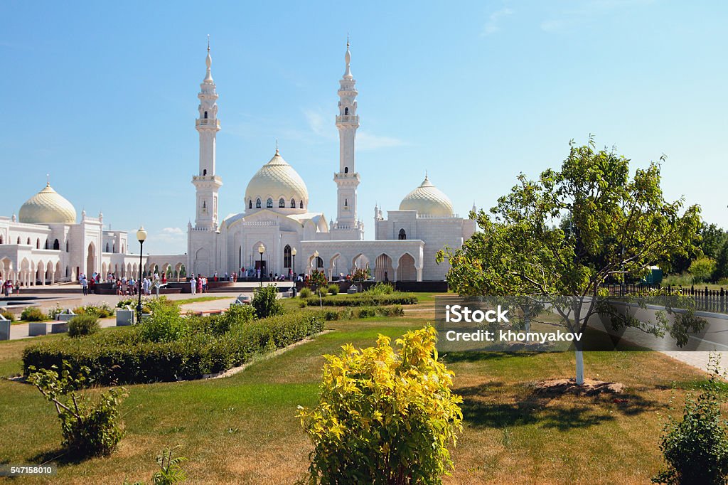 Square garden before temple. White mosque, Bulgar, Russia Bulgar — the city in Russia, an administrative center of the Spassky district of Tatarstan. Well-known "The joint stock company throws" has been constructed in 2012. Further the construction will be surrounded with an orchard and flower beds. Mosque Stock Photo