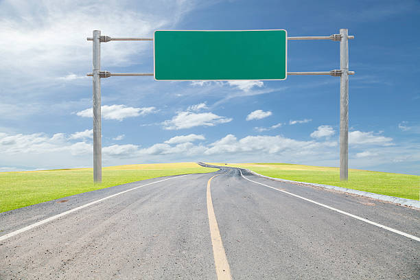 istock blank green road-sign for your advertisement  with space for tex 547158470