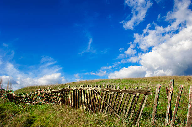 istock Rustic Wood Fence Against Cloudy Blue Sky 547160922