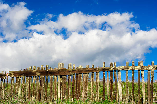 istock Rustic Wood Fence Against Cloudy Blue Sky 547161350