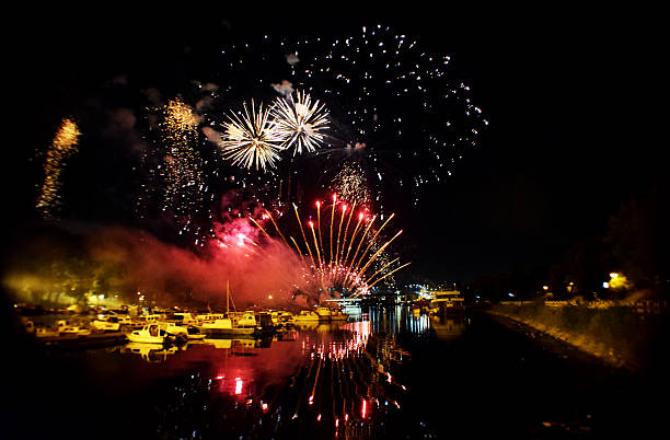 istock fireworks explosion of colors reflection on the river 547161628