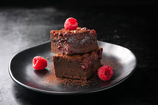 istock Homemade chocolate sweet brownies cakes with cherry 547162294