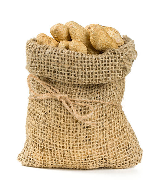 istock peanuts in a miniature burlap bag isolated on white 547163738