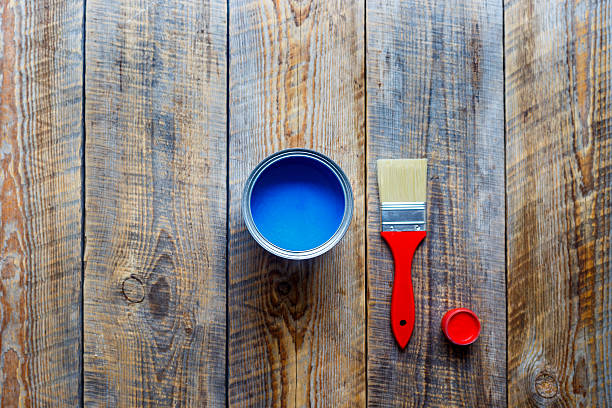 istock jar with blue paint on the wooden background top view 547164832