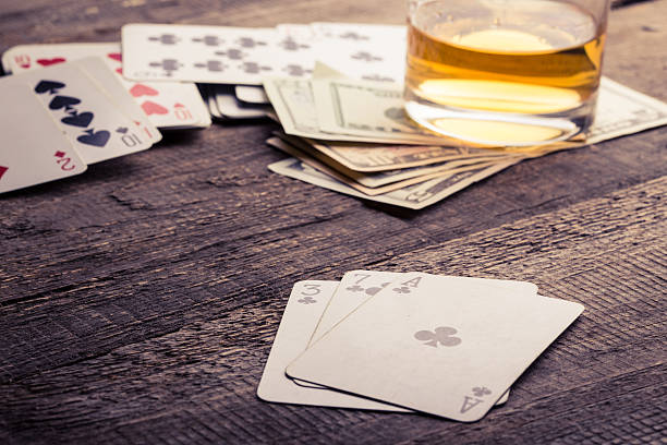 istock cards, whisky and money 547165006