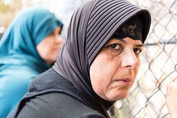 istock Sad refugees Middle eastern women (Real People) 547165632
