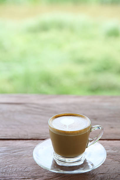 istock cappuccino coffee on wood background 547166612