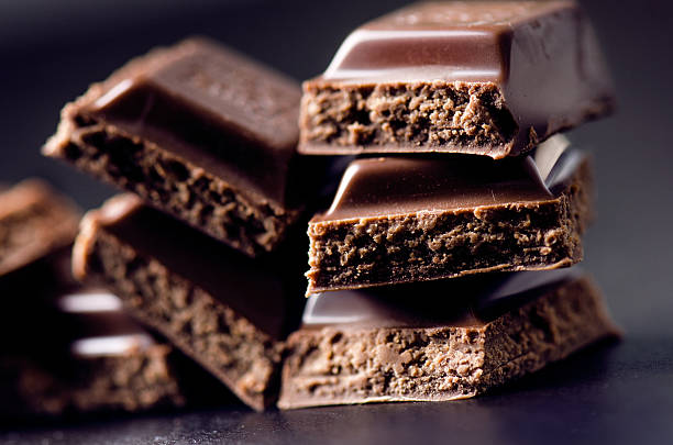 istock Two chocolate buildings on a dark background. energy and sugar. 547167018