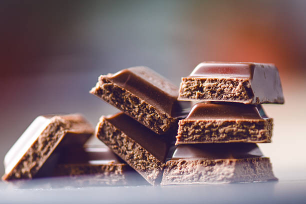 istock Two chocolate buildings on a dark background. energy and sugar. 547167094