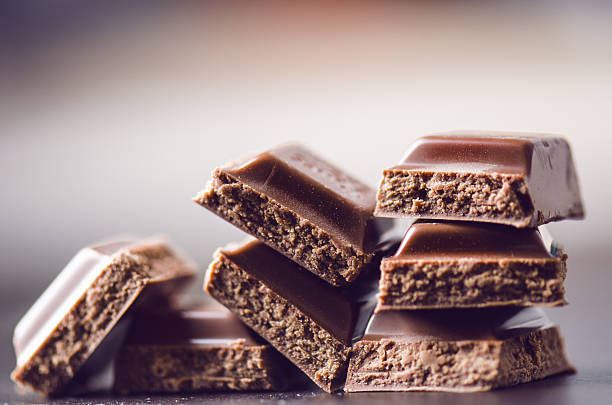 istock Two chocolate buildings on a dark background. energy and sugar. 547167218