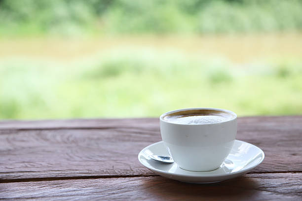 istock cappuccino coffee on wood background 547167924