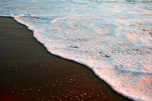istock Beautiful sunset reflected from the ocean and the sands. 547168212