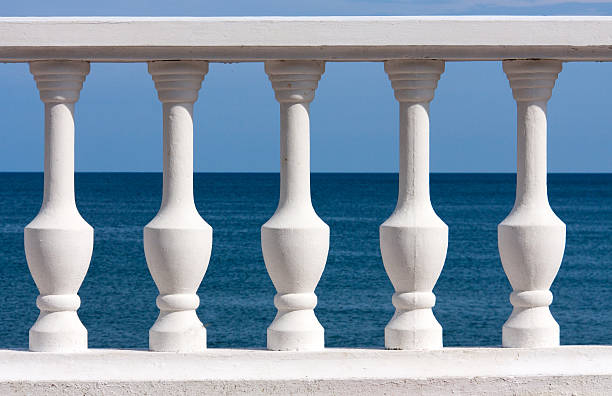 istock white balusters on sea and sky background 547168232