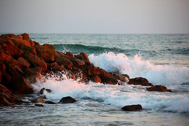 istock Ocean waves rushing against the reef during Sunset. 547169454