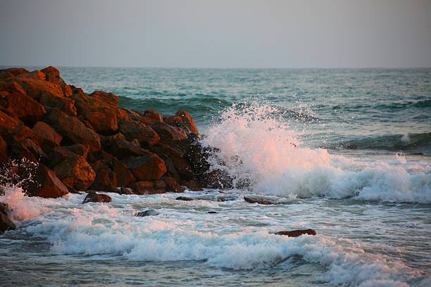 Ocean waves rushing against the reef during Sunset.